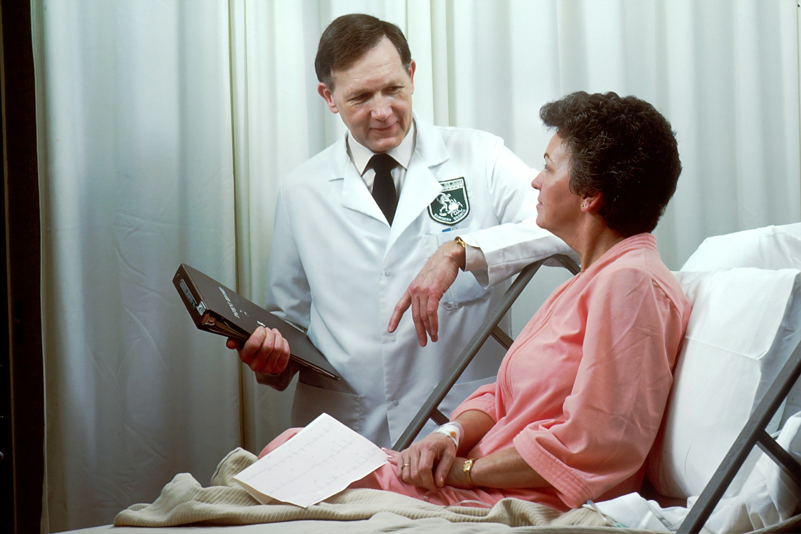 A physician reviewing treatment options with a patient and her family